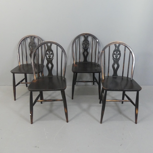 2154 - ERCOL - A set of four Fleur de lys dining chairs.