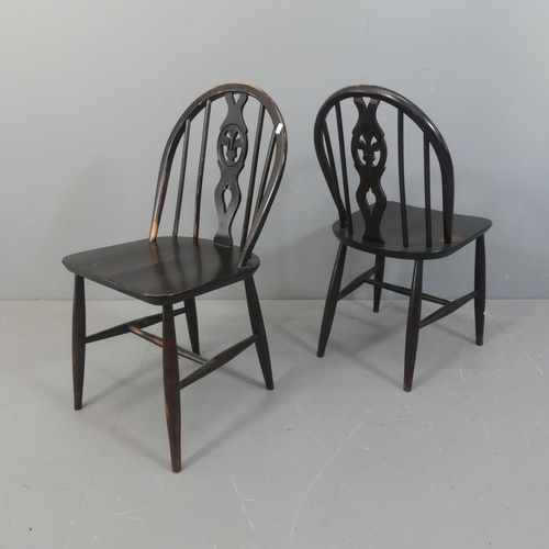 2154 - ERCOL - A set of four Fleur de lys dining chairs.