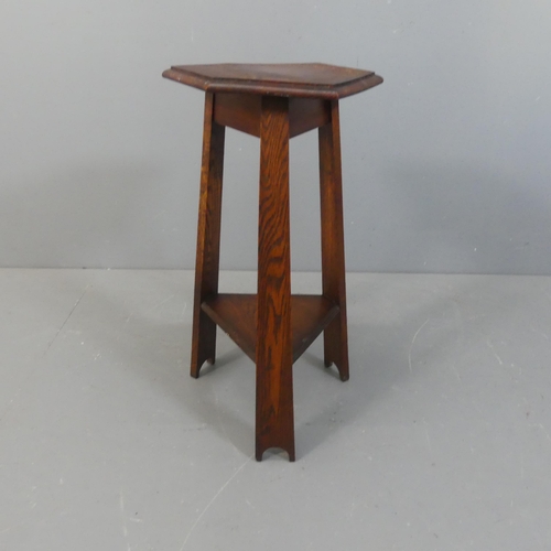 2156 - An Arts & Crafts style oak two tier lamp table on tripod base, in the manner of Liberty & Co.. Width... 