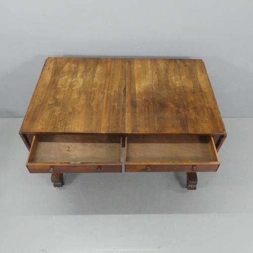 2159 - A Regency rosewood centre-standing sofa table, with two drawers, turned stretcher and carved decorat... 