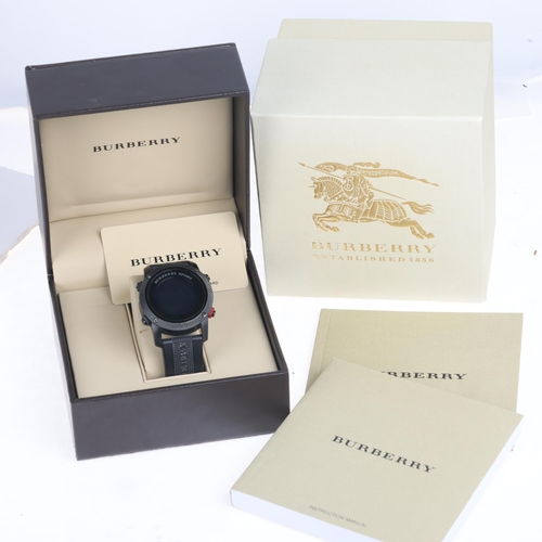 1025 - BURBERRY - a black Ionized stainless steel Sport digital quartz wristwatch, ref. BU7704, digital dia... 