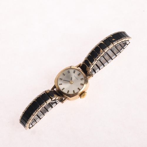 1032 - TISSOT - a lady's 9ct gold mechanical wristwatch, ref. 43486, circa 1968, concave silvered dial with... 