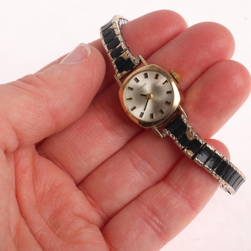 1032 - TISSOT - a lady's 9ct gold mechanical wristwatch, ref. 43486, circa 1968, concave silvered dial with... 