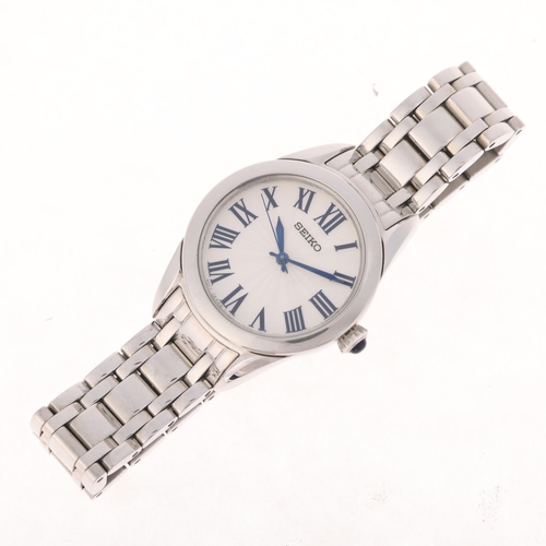 1056 - SEIKO - a lady's stainless steel quartz bracelet watch, ref. 7N01-0GT0, silvered engine turned dial ... 