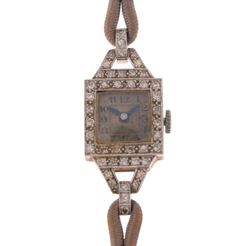 1060 - A lady's Art Deco platinum diamond mechanical cocktail wristwatch, by Isis, circa 1920s, silvered di... 