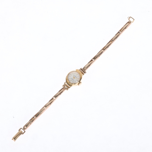 1061 - HELVROS - a lady's Vintage 18ct gold mechanical bracelet watch, circa 1960s, silvered dial with gilt... 