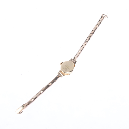 1061 - HELVROS - a lady's Vintage 18ct gold mechanical bracelet watch, circa 1960s, silvered dial with gilt... 