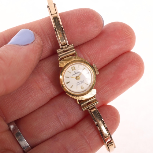 1061 - HELVROS - a lady's Vintage 18ct gold mechanical bracelet watch, circa 1960s, silvered dial with gilt... 