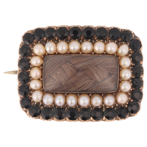 1214 - An Antique Georgian hairwork split pearl and French jet mourning brooch, circa 1820, the central wov... 