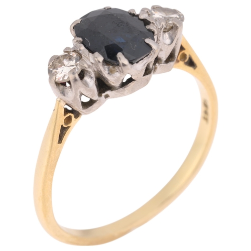 1216 - An 18ct gold three stone sapphire and diamond ring, claw set with oval mixed-cut sapphire and modern... 