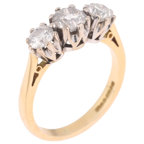 1219 - An 18ct gold three stone diamond ring, maker CMJ, London 1991, claw set with modern round brilliant-... 