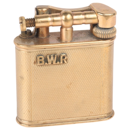 1222 - ALRED DUNHILL - an Art Deco 9ct gold lighter, maker AD, London 1946, oval form with allover engine t... 