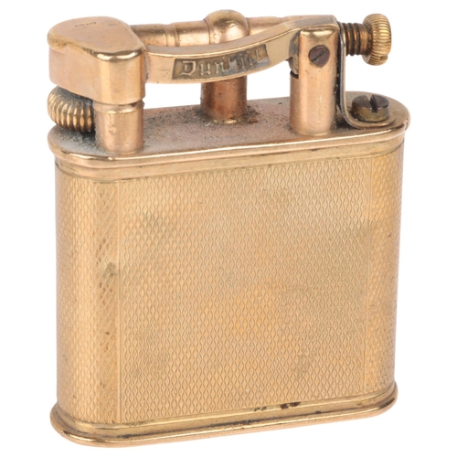 1222 - ALRED DUNHILL - an Art Deco 9ct gold lighter, maker AD, London 1946, oval form with allover engine t... 