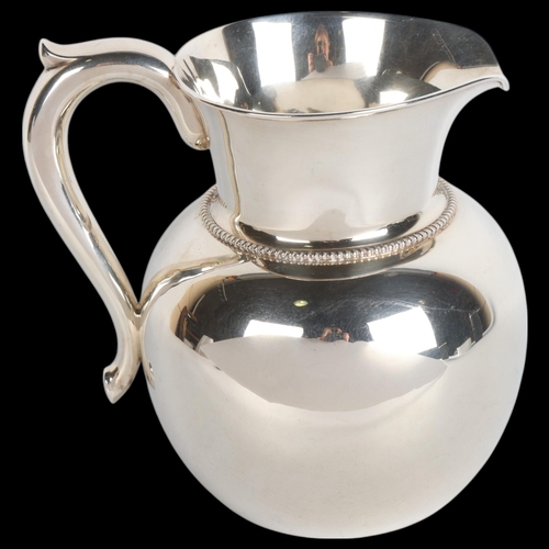 1761 - An American sterling silver three and a half pint water/wine jug, by A Stowell & Co, height 17cm, 15... 