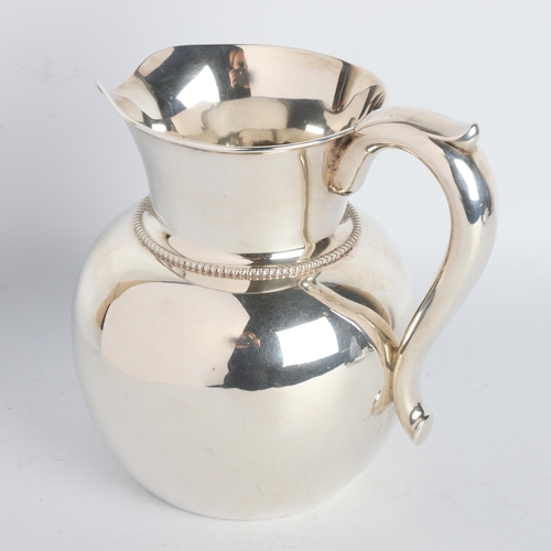 1761 - An American sterling silver three and a half pint water/wine jug, by A Stowell & Co, height 17cm, 15... 