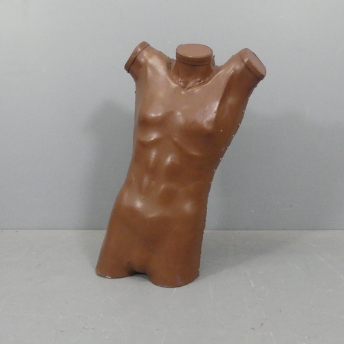 2239 - A mid-century fibre glass male torso clad in leather. Height 83cm.