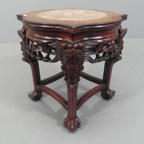 2049 - A Chinese hardwood Jardinière stand, with inset marble top and all-over carved and pierced decoratio... 