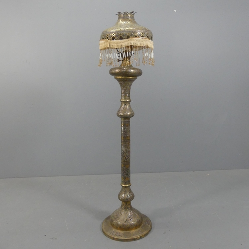 2053 - A middle-eastern floor standing oil lamp and shade. Height overall 153cm.