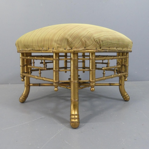 2068 - A 19th century French gilt-painted faux-bamboo and upholstered octagonal footstool. Width 61cm, heig... 