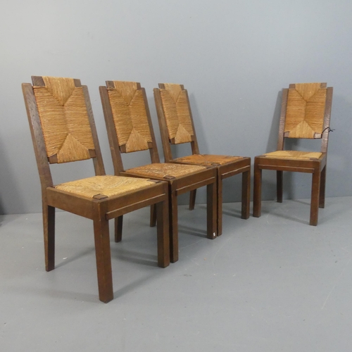 2071 - CHARLES DUDOUYT - A set of four mid-century brutalist oak dining chairs, each with rush drop-in seat... 