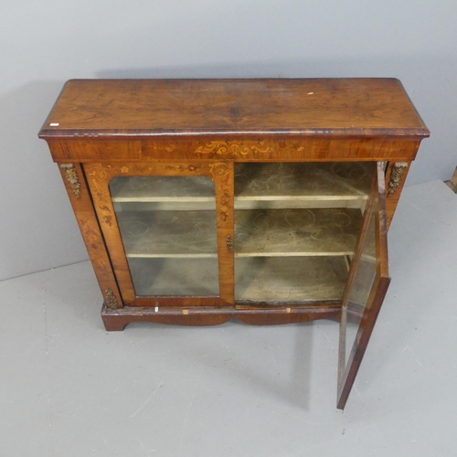 2072 - A 19th century French walnut bookcase, with two glazed panelled doors, and carved and inlaid maruetr... 