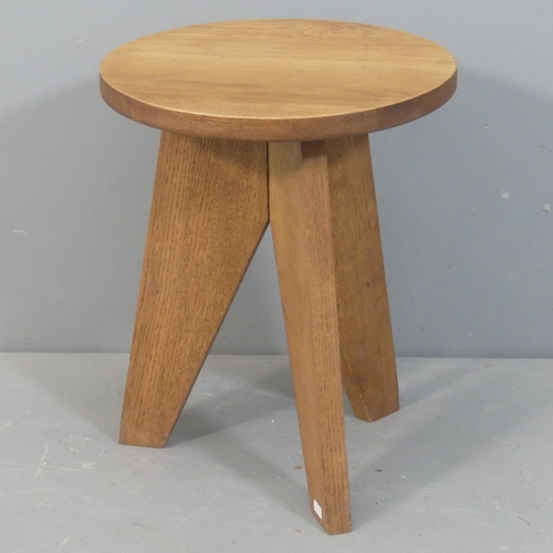 2075 - A French mid-century oak low stool in the manner of Jean Prouve. Height 43cm