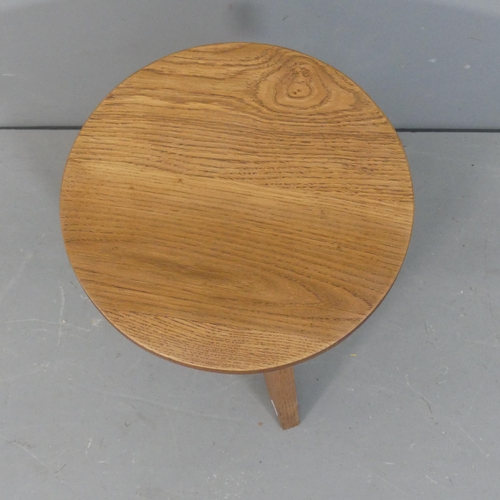 2075 - A French mid-century oak low stool in the manner of Jean Prouve. Height 43cm