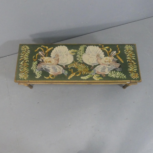 2080 - A French rectangular foot stool, with needlepoint upholstered seat on giltwood base with carved and ... 