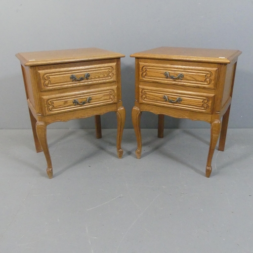 2085 - A pair of French oak bedside chests of two drawers. Width 48cm, height 62cm, depth 38cm.