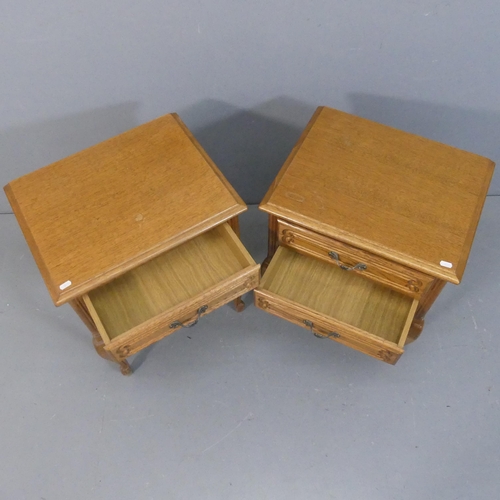 2085 - A pair of French oak bedside chests of two drawers. Width 48cm, height 62cm, depth 38cm.