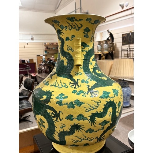 64 - A large Chinese yellow ground porcelain vase, with green enamel dragon decoration, height 56cm