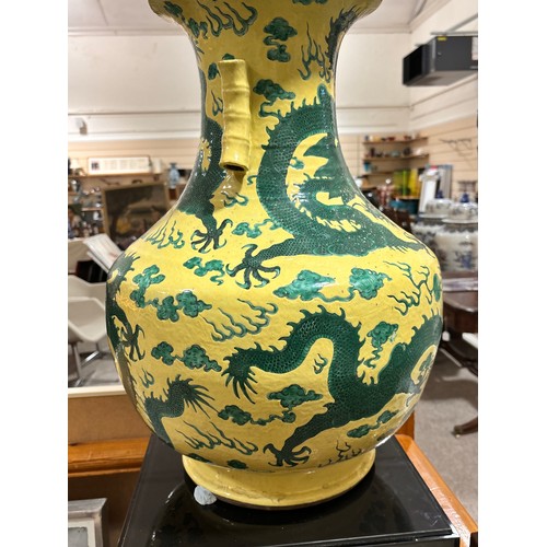 64 - A large Chinese yellow ground porcelain vase, with green enamel dragon decoration, height 56cm