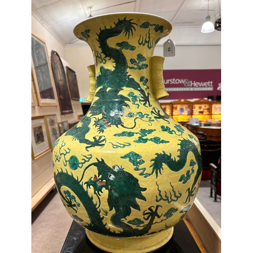 64 - A large Chinese yellow ground porcelain vase, with green enamel dragon decoration, height 56cm