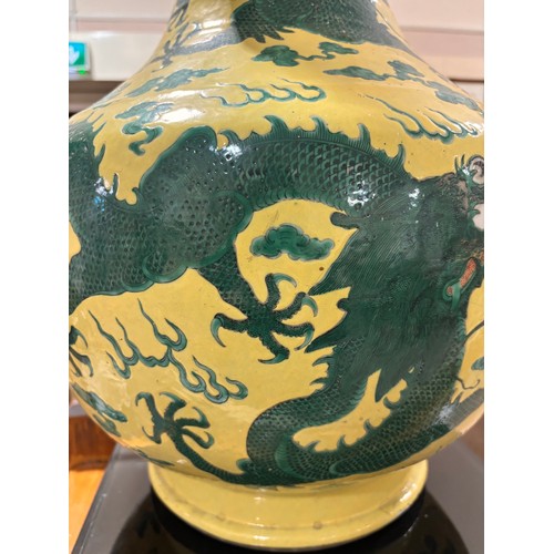 64 - A large Chinese yellow ground porcelain vase, with green enamel dragon decoration, height 56cm