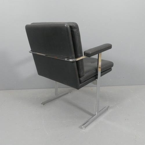 2243 - ROBIN DAY - A mid-century Hille Delphi leather and chrome armchair or desk chair on T shaped legs, w... 