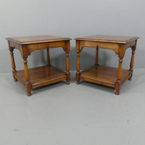 2244 - A pair of oak and mahogany two-tier lamp tables, labelled for Simpson's of Norfolk. Width 55cm, heig... 