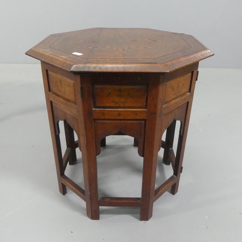 2249 - An Anglo-Indian teak octagonal occasional table, with inlaid ebony and brass decoration and folding ... 