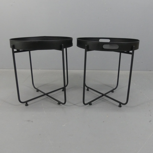 2254 - A pair of contemporary circular tray top occasional tables on tubular metal bases. Diameter 48cm, he... 