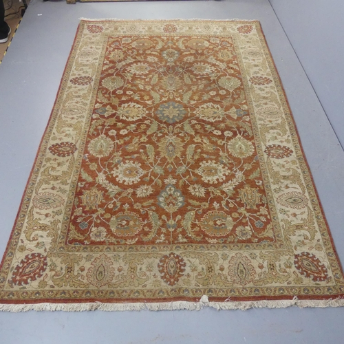 2294 - An Indian wool rug with foliate design. Length 260cm, width 169cm.