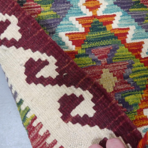 2296 - A Chobi Kilim mat. Length 87cm, width 63cm.