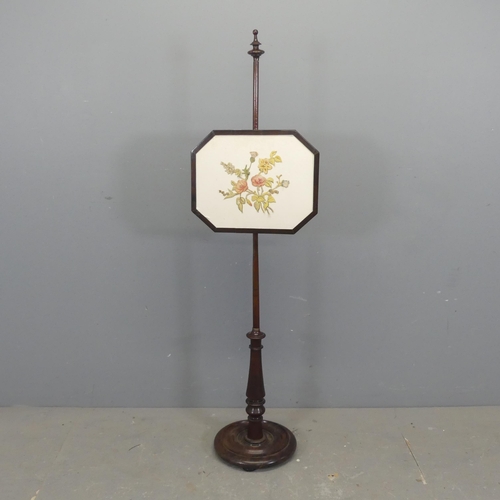 2360 - A 19th century mahogany and upholstered pole screen. Height 140cm.