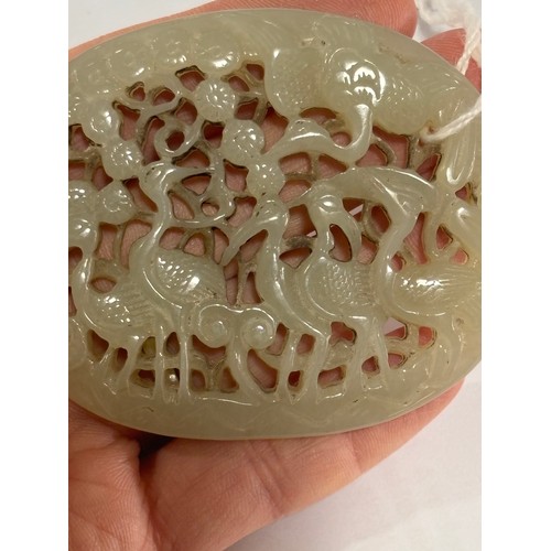 84 - A Chinese relief carved and pierced jade pendant, stork design, Qing Dynasty, 6.5cm x 5.5cm