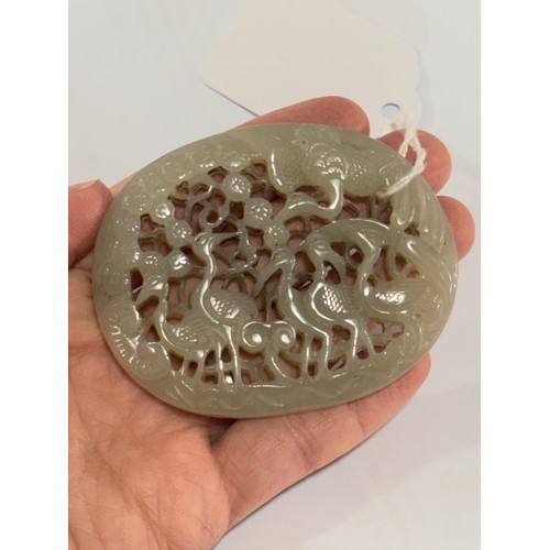 84 - A Chinese relief carved and pierced jade pendant, stork design, Qing Dynasty, 6.5cm x 5.5cm