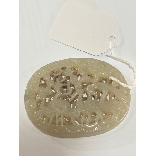 84 - A Chinese relief carved and pierced jade pendant, stork design, Qing Dynasty, 6.5cm x 5.5cm