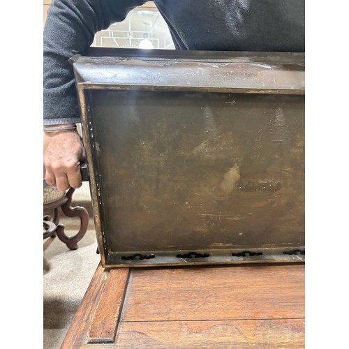 51 - A near pair of massive Chinese patinated bronze planters on oak stands, with elephant and dragon han... 