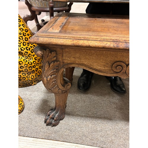 51 - A near pair of massive Chinese patinated bronze planters on oak stands, with elephant and dragon han... 