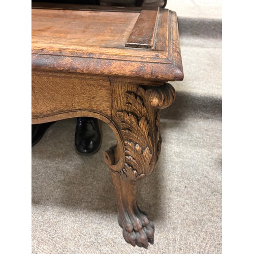 51 - A near pair of massive Chinese patinated bronze planters on oak stands, with elephant and dragon han... 