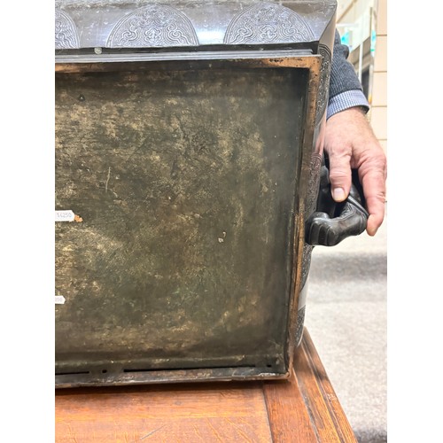 51 - A near pair of massive Chinese patinated bronze planters on oak stands, with elephant and dragon han... 