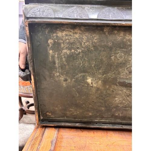 51 - A near pair of massive Chinese patinated bronze planters on oak stands, with elephant and dragon han... 