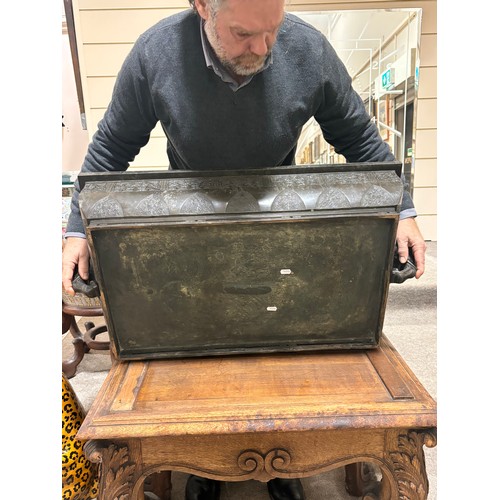 51 - A near pair of massive Chinese patinated bronze planters on oak stands, with elephant and dragon han... 